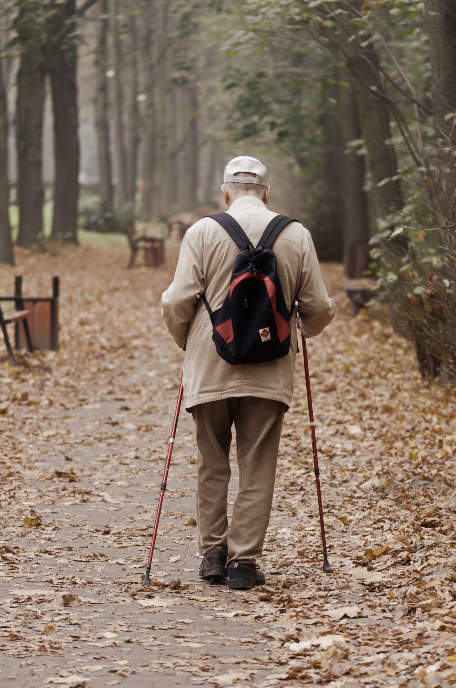 senior man hiking in Fall elder care