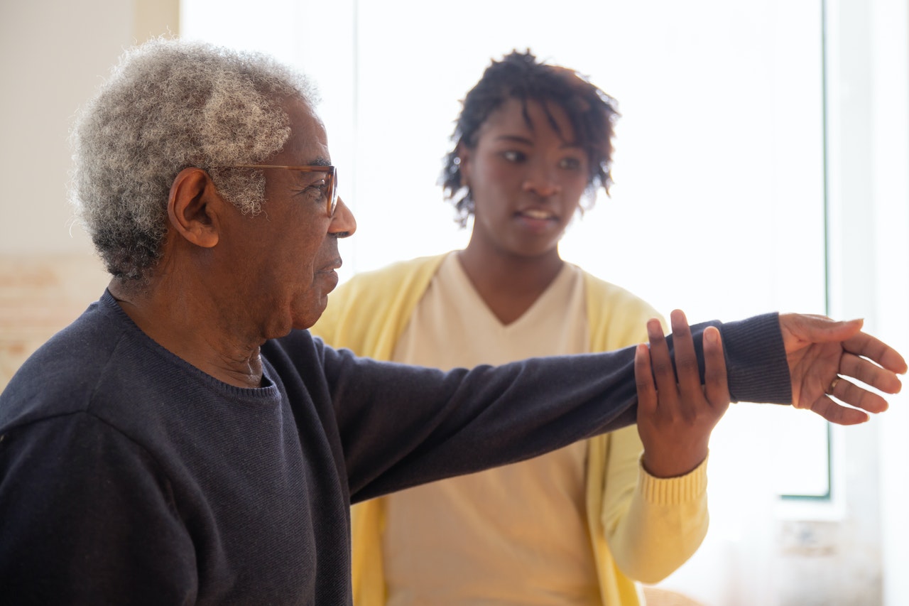 elderly man getting physical therapy