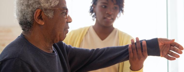 elderly man getting physical therapy