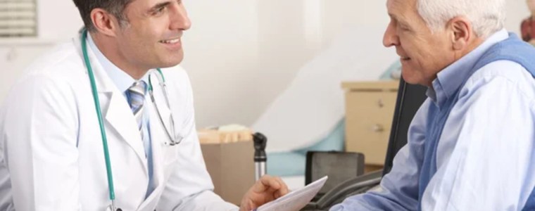 Senior man at a doctor's office talking to doctor